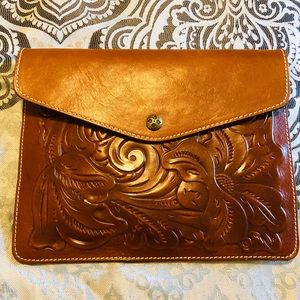 Brand new brown Patricia Nash Leather clutch.